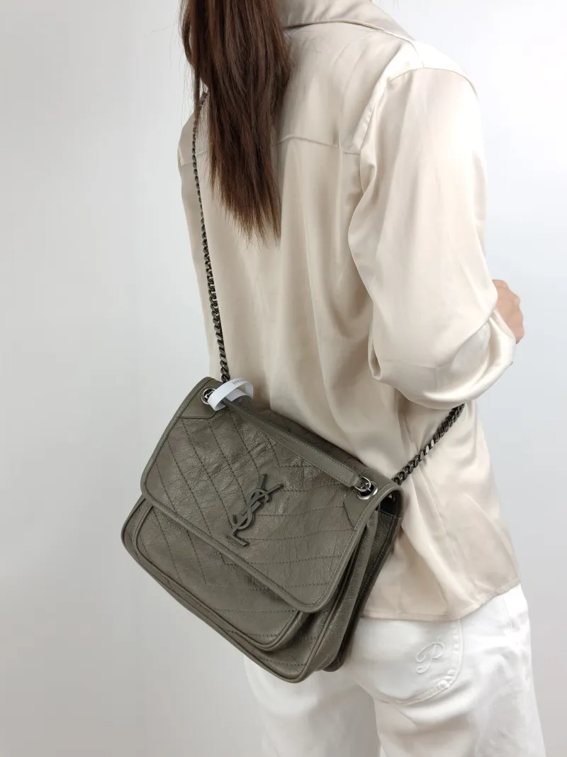SAINT LAURENT Crossbody Bag Niki D Waxed Leather Medium 28 × 8.5 × 20 cm — on-model view 2 of 2
