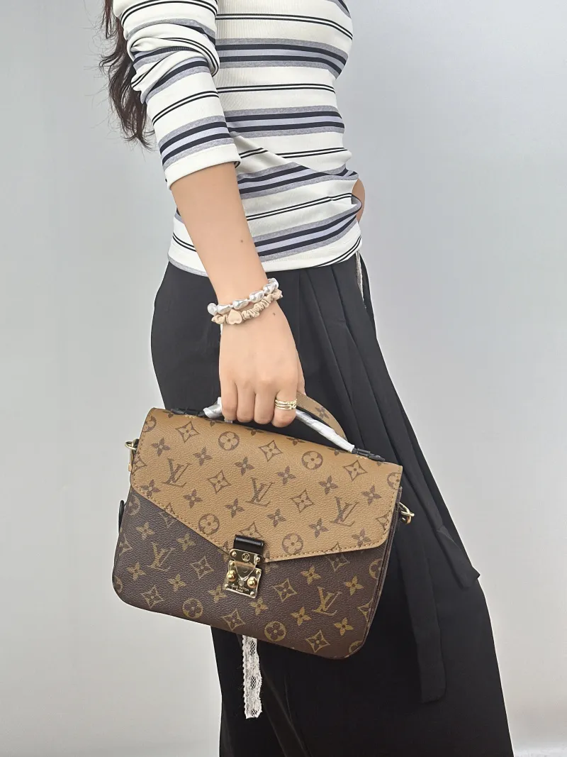 Louis Vuitton Crossbody Bag Pochette Métis Monogram Colorblock PVC Medium25 × 7 × 19 cm — on-model view 1 of 2
