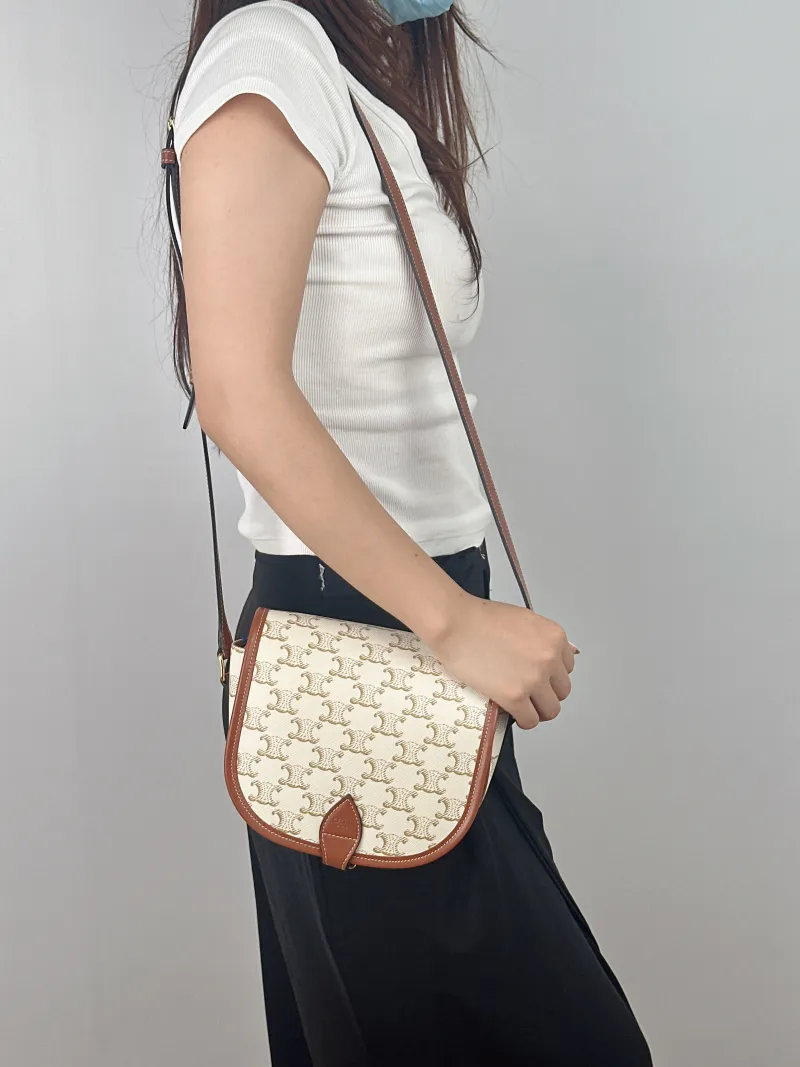CELINE Crossbody Bag FOLCO White PVC Medium 18.5 × 8 × 17 cm — on-model view 2 of 2