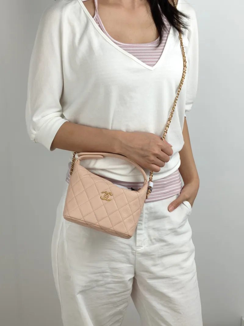 Chanel Crossbody Bag Crossbody Bag Pink Gold-Tone Hardware Grained Calfskin One Size 21.5 × 7.5 × 19 cm — on-model view 1 of 3