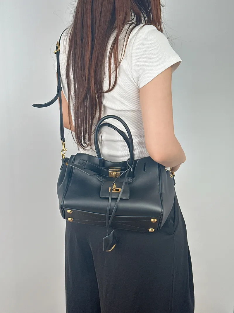 BALENCIAGA Crossbody Bag Bel air Black Calfskinmini23.5 × 8 × 17 cm — on-model view 1 of 2