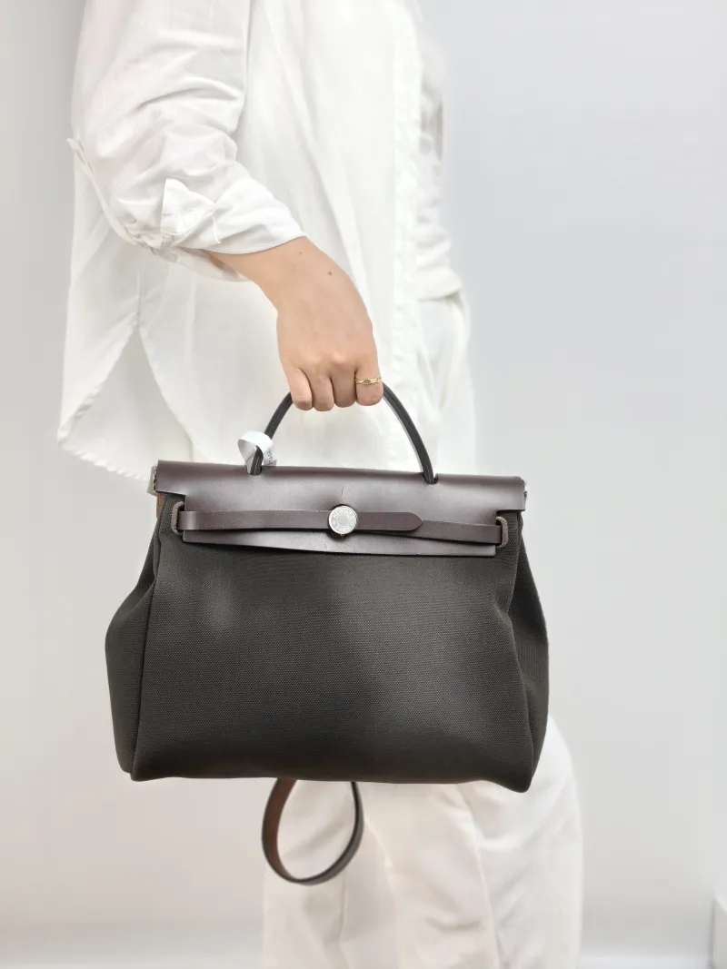 Hermès Crossbody Bag Herbag 31 Colorblock Canvas · Calfskin Medium 30.5 × 11 × 25.5 cm w — on-model view 2 of 2