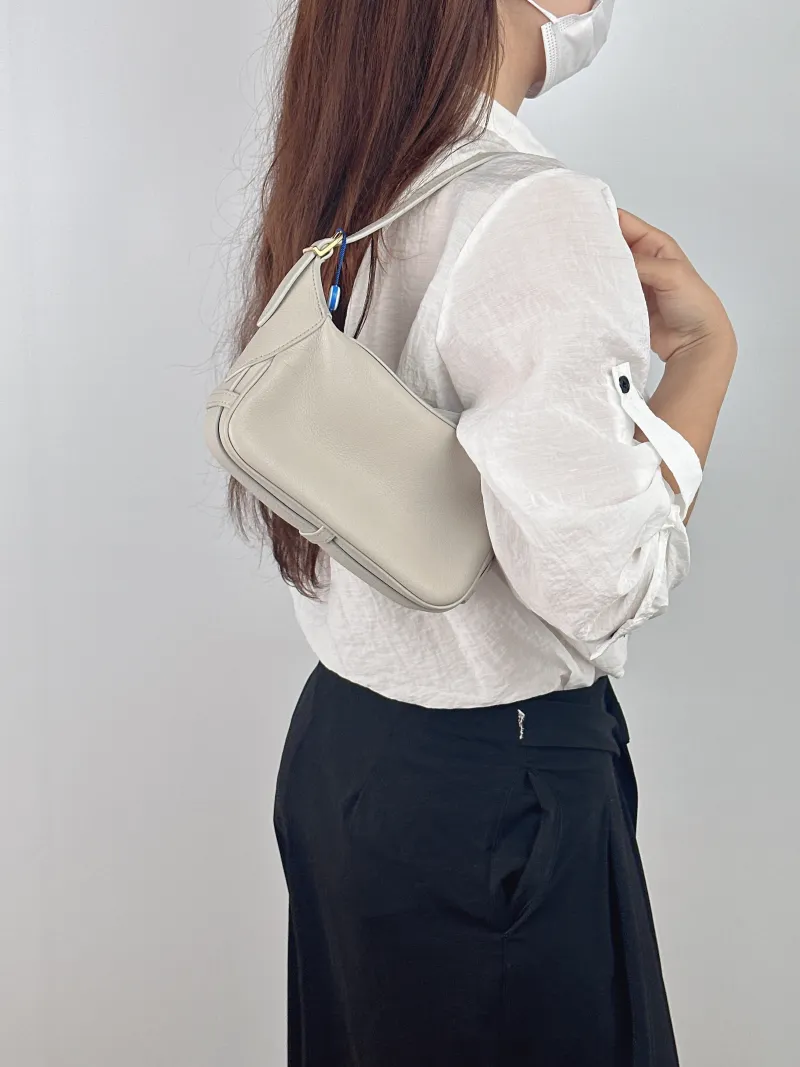 CELINE Shoulder Bag Romy Hobo Shoulder Bag White Calfskin Mini 19 × 5 × 14 cm — on-model view 1 of 2