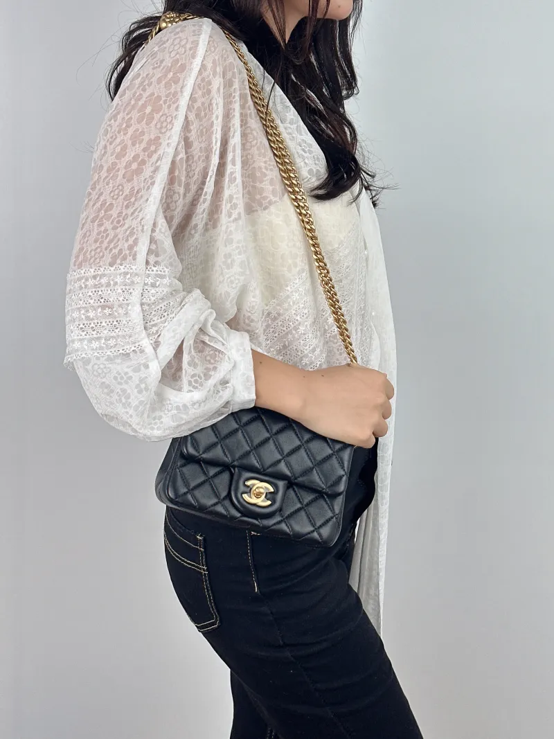 Chanel Crossbody Bag Black with Gold-Tone Hardware Lambskin Mini 17 × 8 × 12 cm — on-model view 2 of 2
