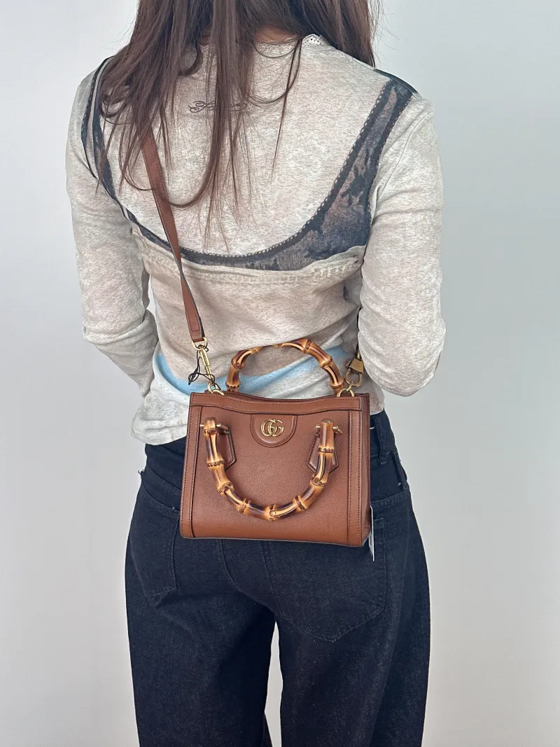 GUCCI Top Handle Bag Diana Top Handle Bag Caramel Calfskin Small 20 × 10 × 16 cm — on-model view 2 of 2