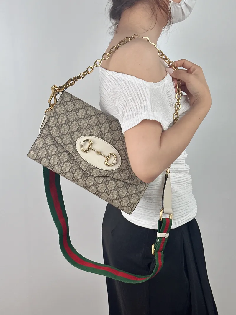 GUCCI Crossbody Bag Horsebit 1955 Two Straps woc Monogram PVC 26 × 3.2 × 16.5 cm — on-model view 1 of 2