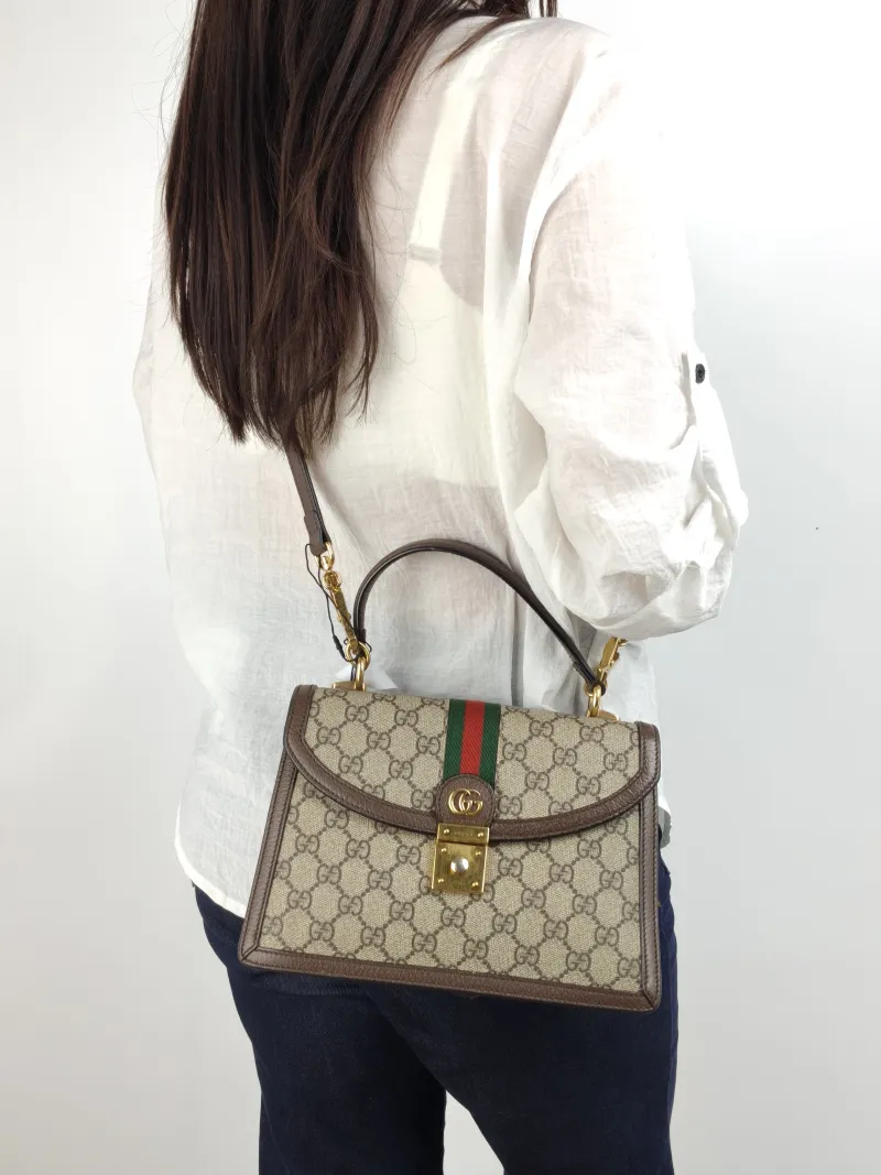GUCCI Top Handle Bag Ophidia GG Messenger Bag Monogram PVC Medium 25 × 7 × 17.5 cm — on-model view 2 of 2