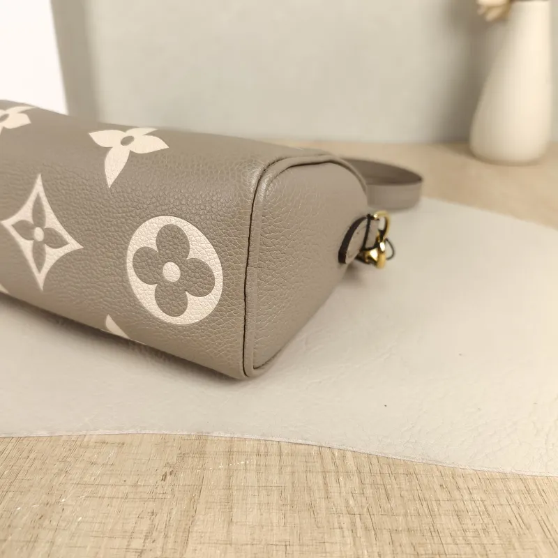 Louis Vuitton Crossbody Bag Speedy Nano · White Empreinte Embossed Calfskin Monogramnano16 × 7.5 × 10 cm — detail view 1 of 11