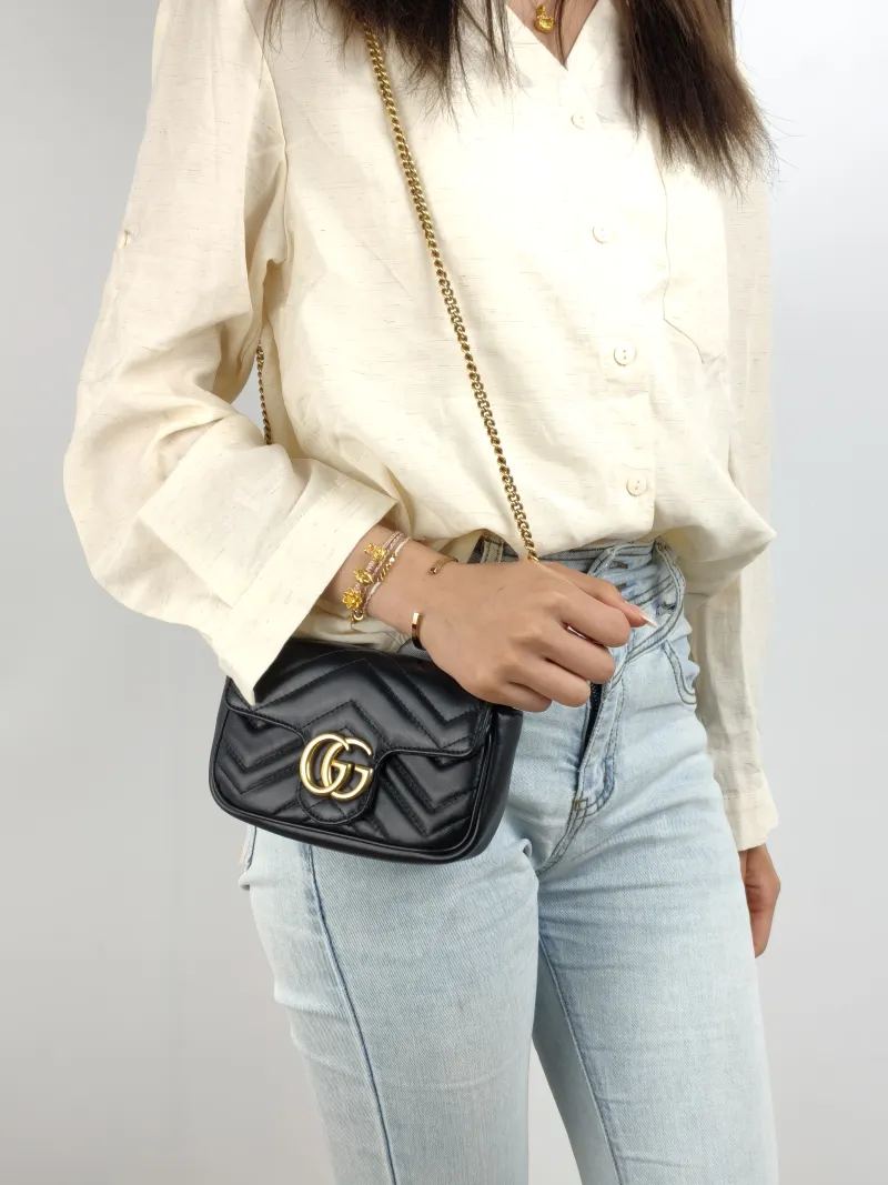 GUCCI Crossbody Bag GG Marmont Mini Marmont Mini Black Calfskin Mini 16.5 × 4.5 × 9.5 cm — on-model view 2 of 2