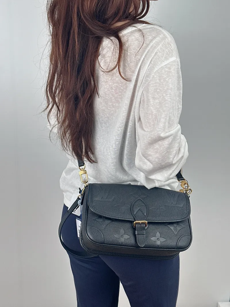 Louis Vuitton Crossbody Bag Diane Baguette Bag Black Empreinte Embossed Calfskin Small24 × 9 × 15 cm — on-model view 2 of 2