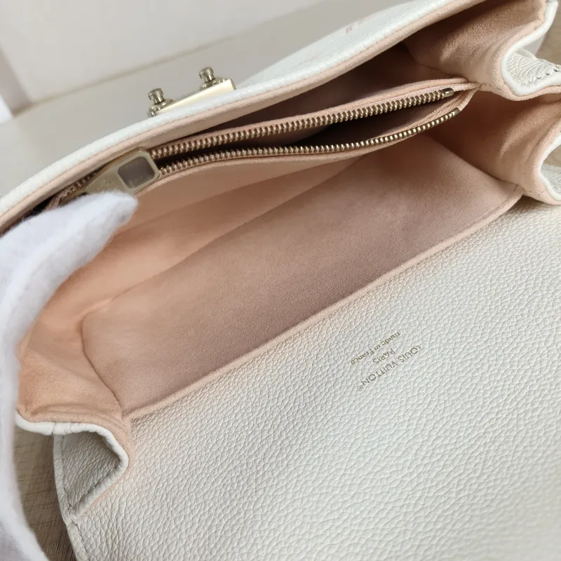 Louis Vuitton Crossbody Bag Pochette Métis East West White · Pink Monogram Empreinte Embossed Calfskin Small 21.5 × 6 × 13.5 cm — detail view 10 of 13
