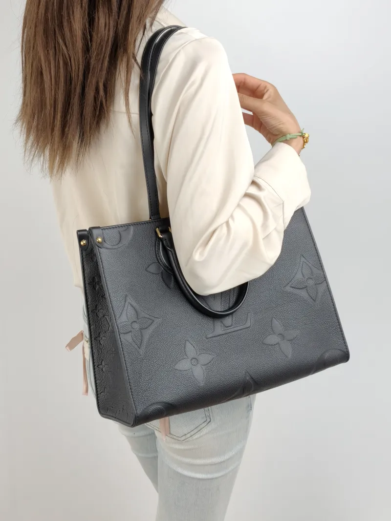 Louis Vuitton Shoulder Bag Onthego Medium Black Monogram Empreinte Embossed Calfskin Medium 35 × 14 × 27 cm — on-model view 2 of 2
