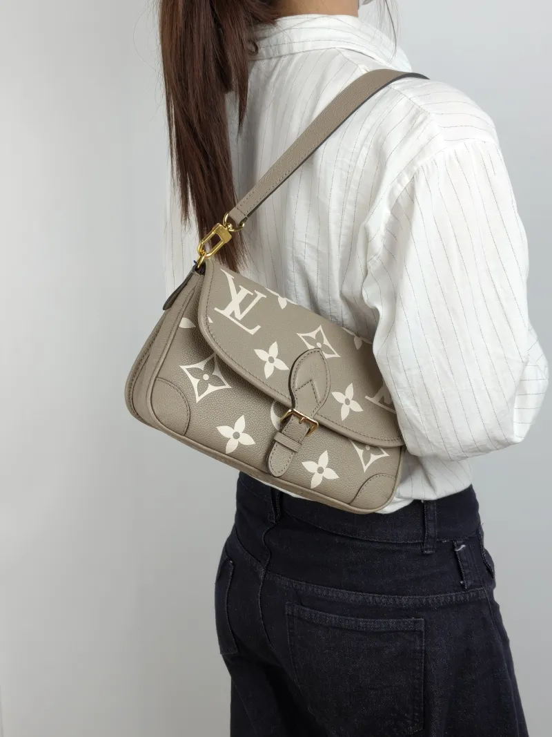 Louis Vuitton Crossbody Bag Diane Baguette Bag Monogram Empreinte Embossed Calfskin Small 24 × 9 × 15 cm — on-model view 1 of 2