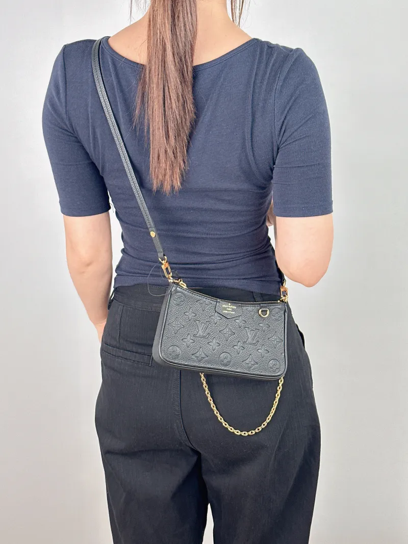 Louis Vuitton Crossbody Bag EASY POUCH ON STRAP Black Monogram Empreinte Embossed Calfskin Mini 19 × 3 × 11.5 cm — on-model view 2 of 2
