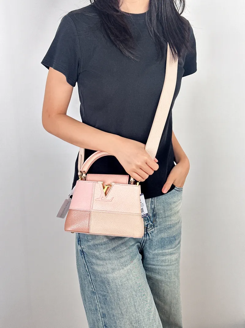Louis Vuitton Crossbody Bag Capucines Pink Colorblock Calfskin · mini21 × 8 × 14 cm — on-model view 2 of 3