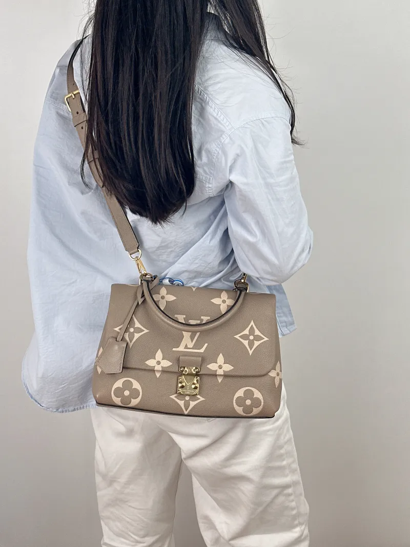 Louis Vuitton Crossbody Bag MADELEINE Empreinte Embossed Calfskin Medium30 × 11 × 19.5 cm — on-model view 2 of 2