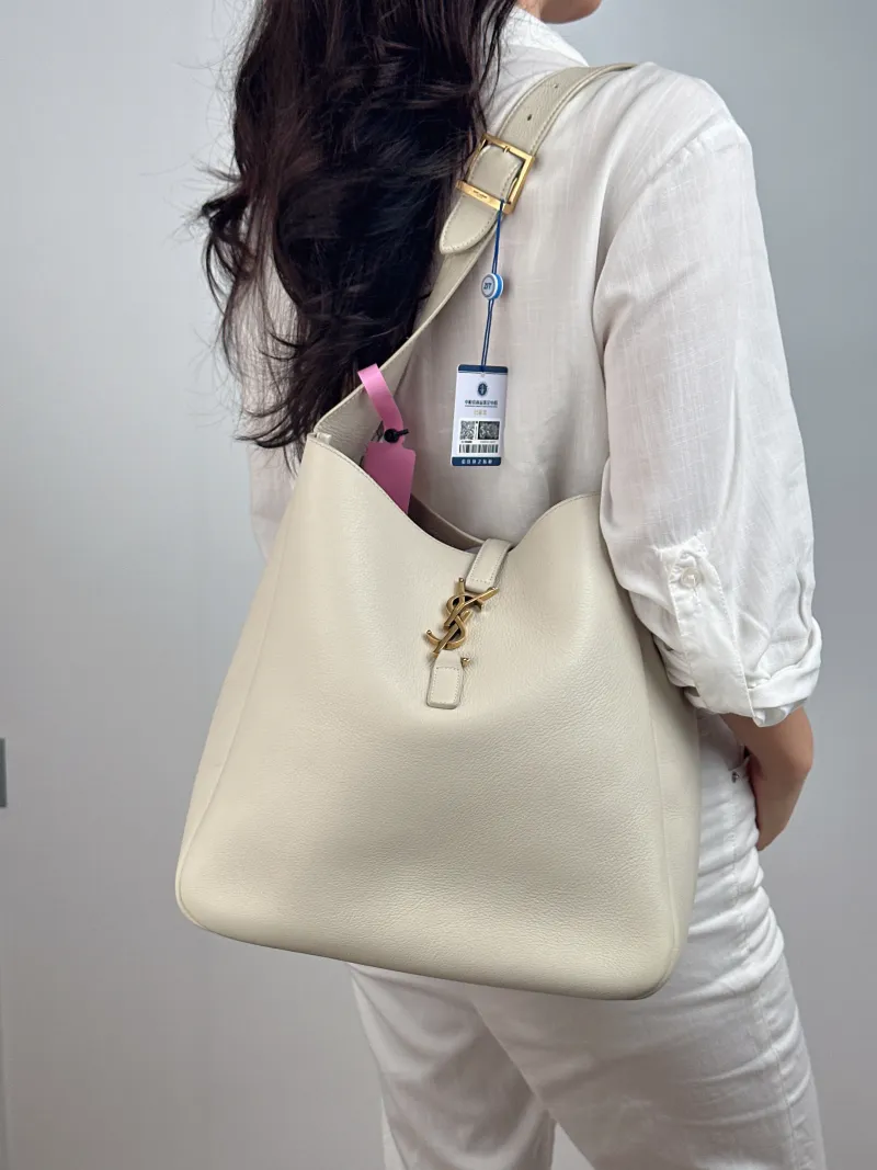 SAINT LAURENT Shoulder Bag LE 5 À 7 Hobo White Calfskin Large 30 × 13 × 31 cm — on-model view 2 of 2