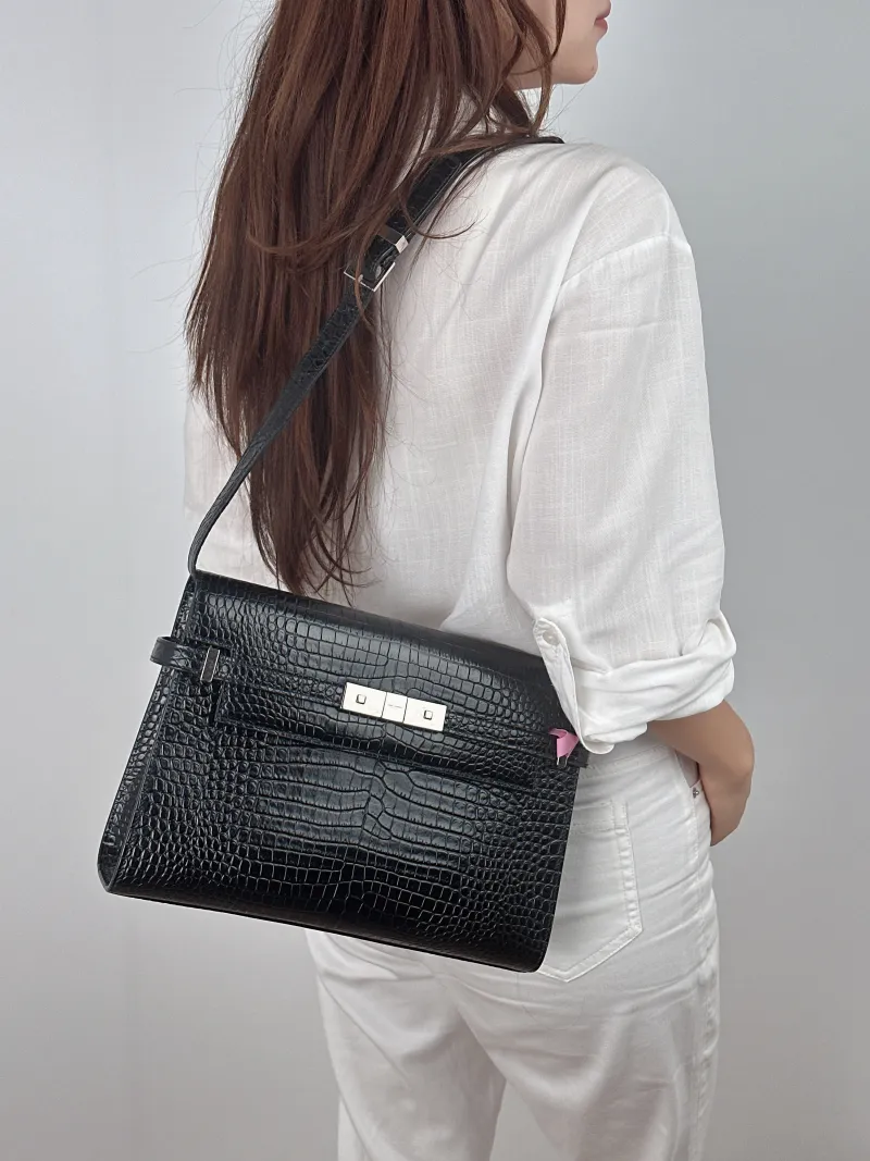 SAINT LAURENT Shoulder Bag MANHATTAN Black Embossed Calfskin Medium 29 × 7.5 × 20 cm — on-model view 1 of 2