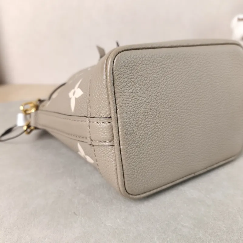 Louis Vuitton Crossbody Bag NANO NOÉ Bucket Bag Nano · White Monogram Empreinte Embossed Calfskin nano 13 × 10 × 16 cm — detail view 1 of 10