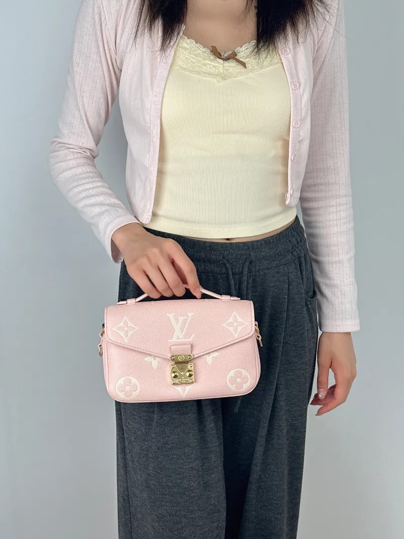Louis Vuitton Crossbody Bag Pochette Métis East West Empreinte Embossed Calfskin Monogram Small21.5 × 6 × 13.5 cm — on-model view 1 of 2