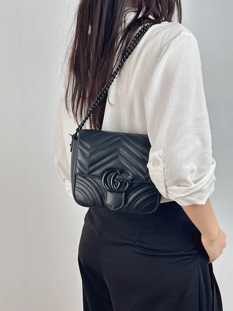 GUCCI Crossbody Bag GG Marmont Marmont Black Calfskin Mini 18 × 8 × 15 cm — on-model view 2 of 2