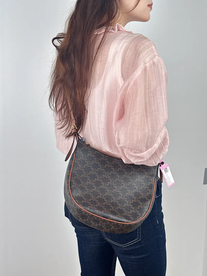 CELINE Shoulder Bag HELOISE TRIOMPHE Monogram PVC Small 24 × 7 × 21 cm — on-model view 1 of 2