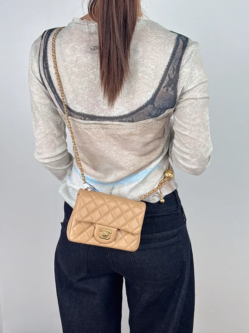 Chanel Crossbody Bag Taupe Lambskinmini17 × 8 × 13.5 cm — on-model view 1 of 2