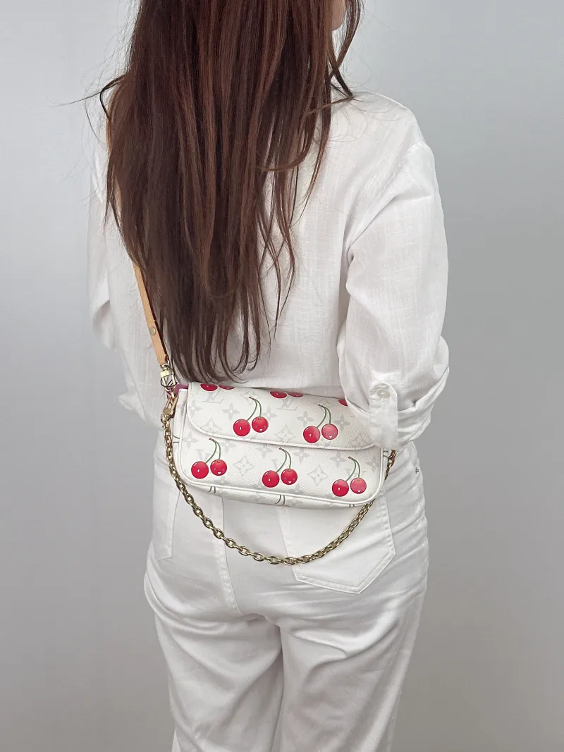 Louis Vuitton Crossbody Bag IVY White · PVC Small 23.5 × 4.3 × 12 cm — on-model view 1 of 2