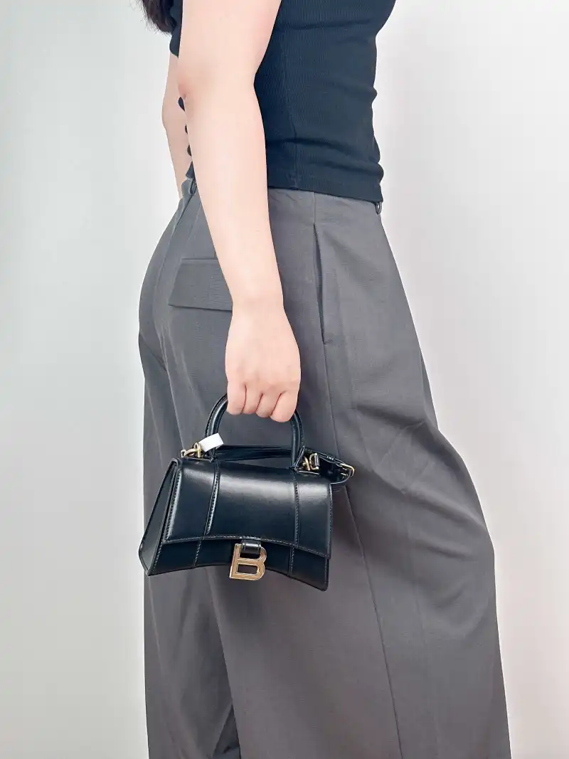 BALENCIAGA Crossbody Bag Hourglass Hourglass Bag Black Calfskin XS 19 × 8 × 13 cm — on-model view 2 of 3