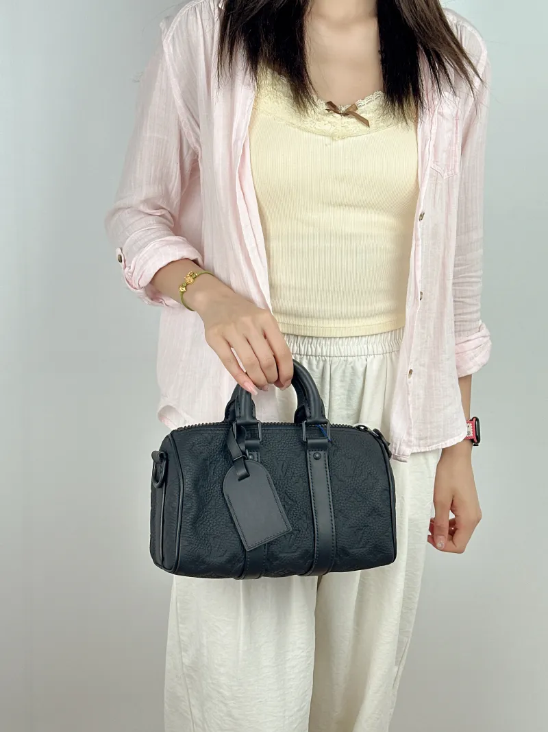 Louis Vuitton Crossbody Bag Keepall 25 Taurillon Embossed Calfskin Monogram Medium25 × 11 × 15 cm — on-model view 2 of 2