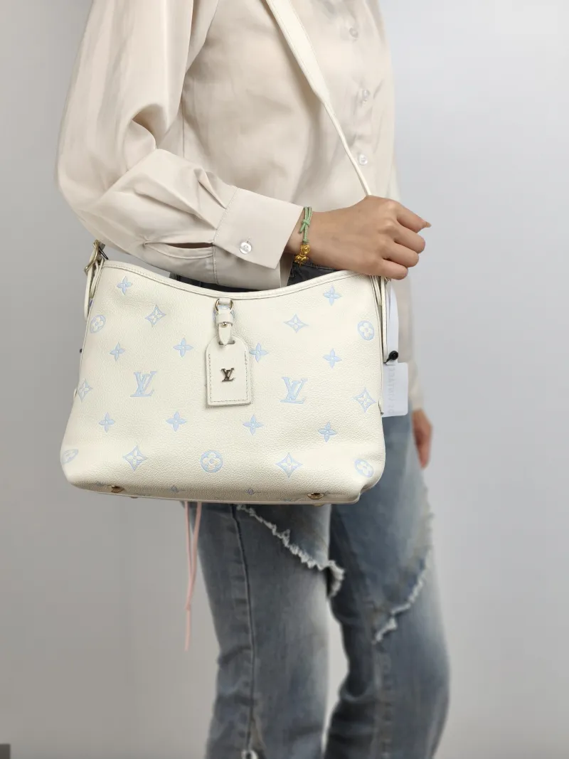Louis Vuitton Crossbody Bag Carryall White · Blue Calfskin Small 29.5 × 12 × 24 cm — on-model view 1 of 2