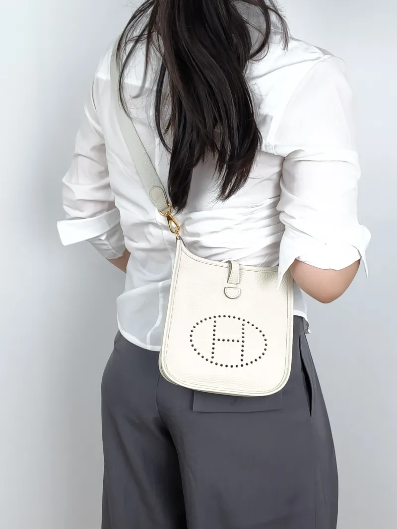 Hermès Crossbody Bag Evelyne Mini 16 Mini 1610Craie TC Calfskinmini17 × 5.5 × 18 cm — on-model view 1 of 2