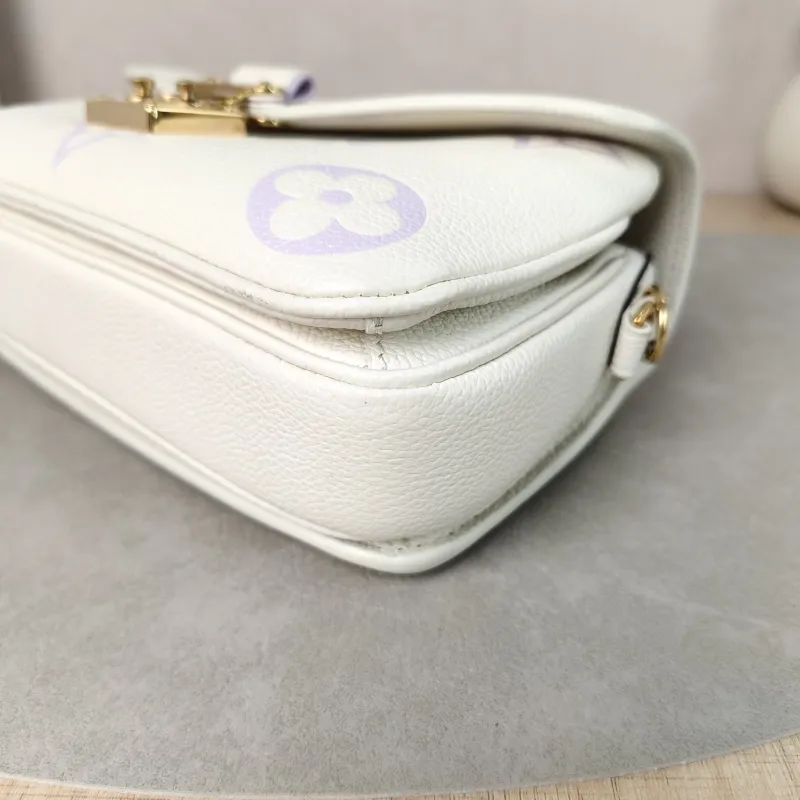 Louis Vuitton Crossbody Bag Pochette Métis East West White · Monogram Empreinte Embossed Calfskin Small 21.5 × 6 × 13.5 cm — detail view 7 of 14