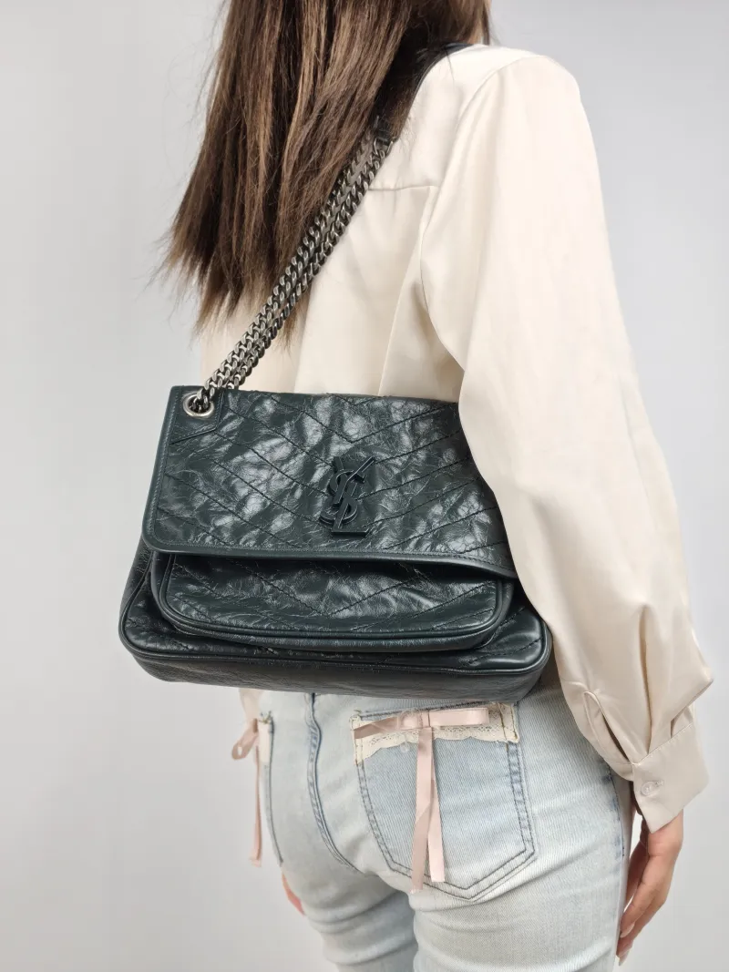 SAINT LAURENT Crossbody Bag Niki D Green Waxed Leather Medium 28 × 8.5 × 20 cm — on-model view 1 of 2