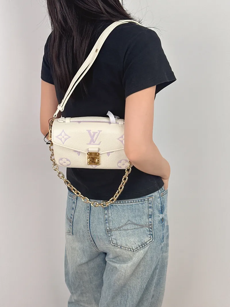 Louis Vuitton Crossbody Bag Pochette Métis East West White · Monogram Empreinte Embossed Calfskin Small 21.5 × 6 × 13.5 cm — on-model view 1 of 4