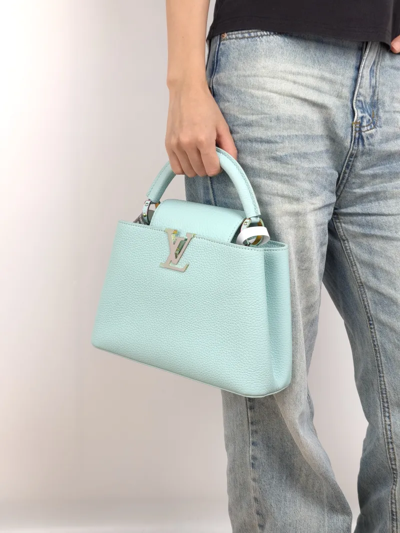 Louis Vuitton Top Handle Bag Capucines Blue Calfskin BB 27 × 9 × 17.5 cm — on-model view 3 of 3