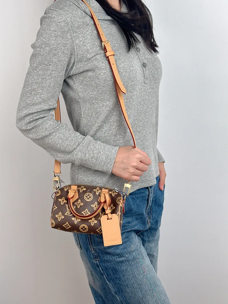 Louis Vuitton Crossbody Bag Speedy Nano Brown PVC nano 16 × 7.5 × 10 cm — on-model view 1 of 3