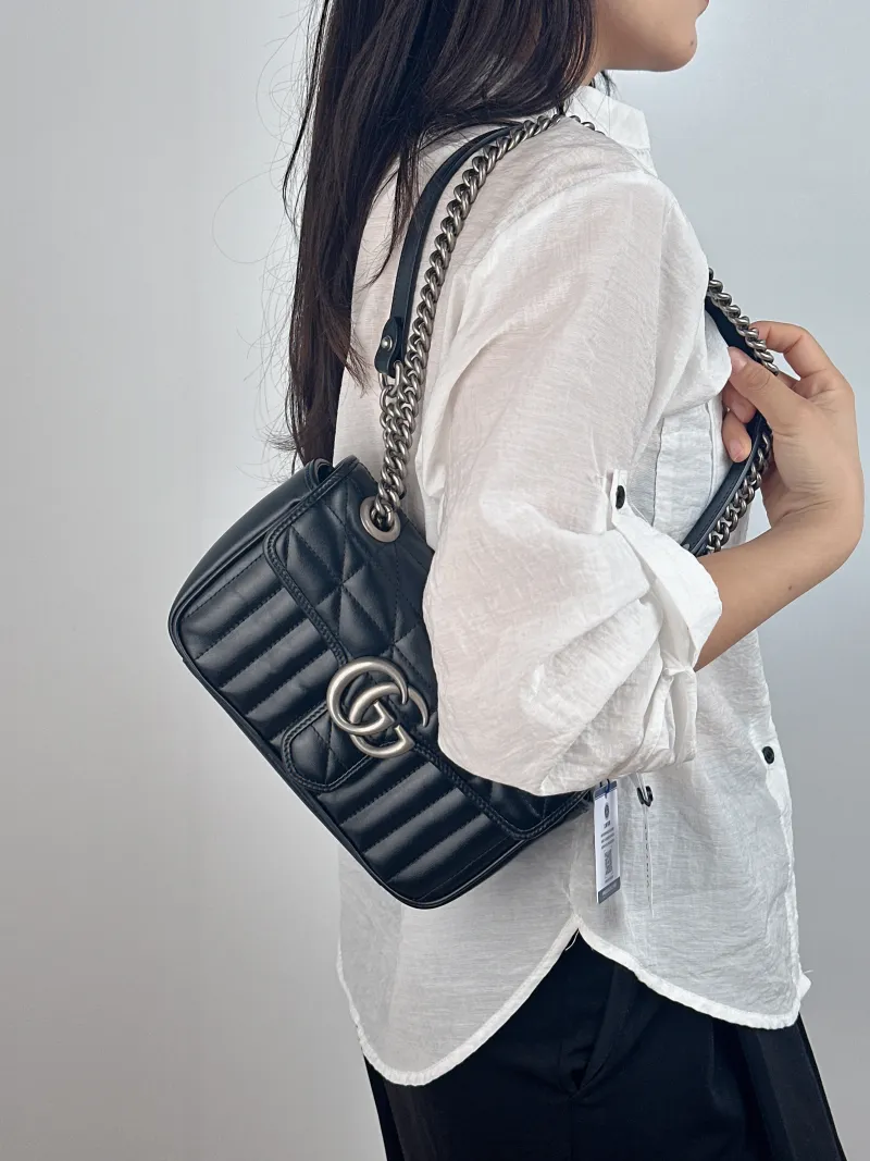 GUCCI Crossbody Bag GG Marmont Small Marmont 22 Black Calfskin Small 22 × 6 × 13 cm — on-model view 1 of 2