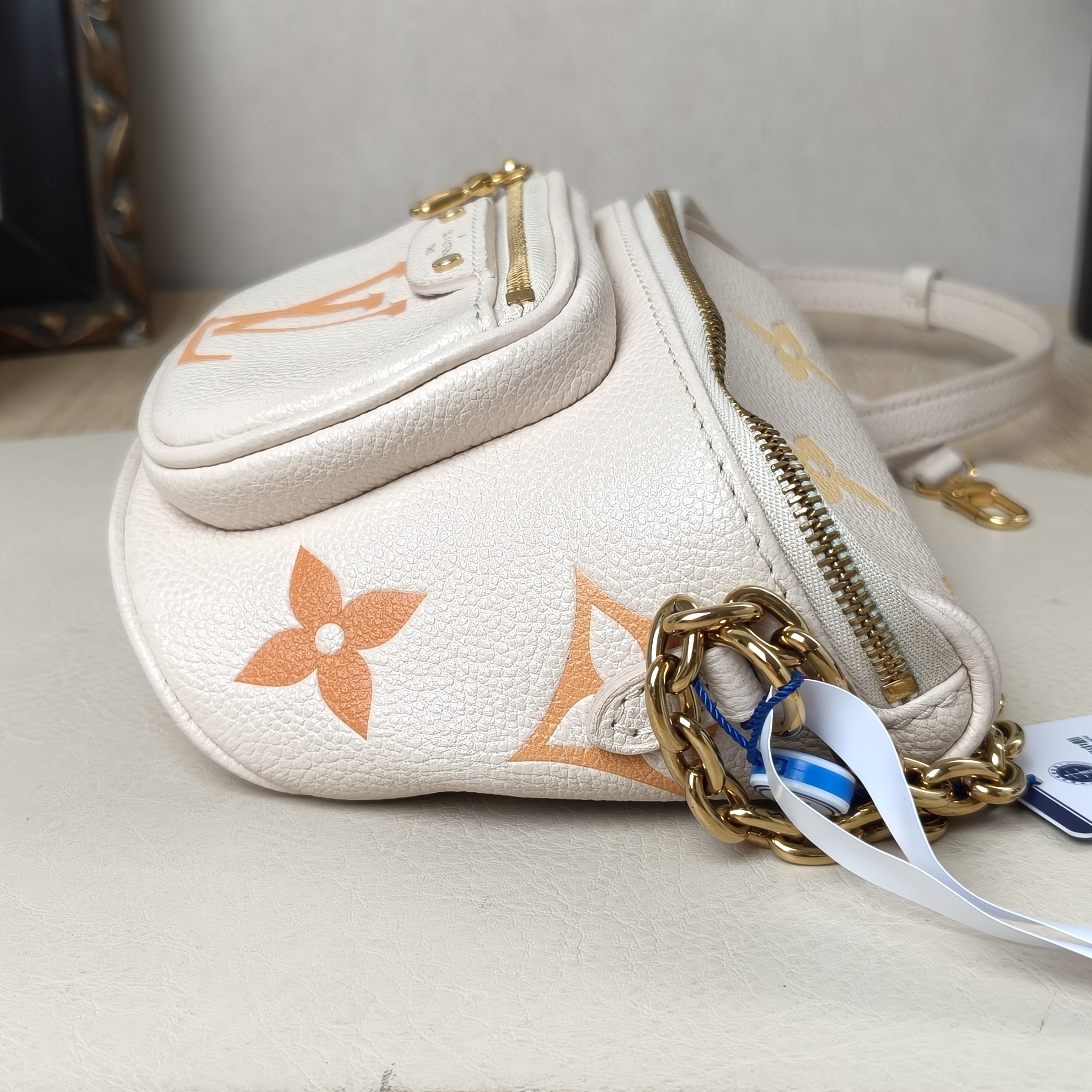 Louis Vuitton Belt Bag mini Beige Calfskin Microchip Edition · Two Straps · 17 × 9.5 × 12 cm — cover view 8 of 9
