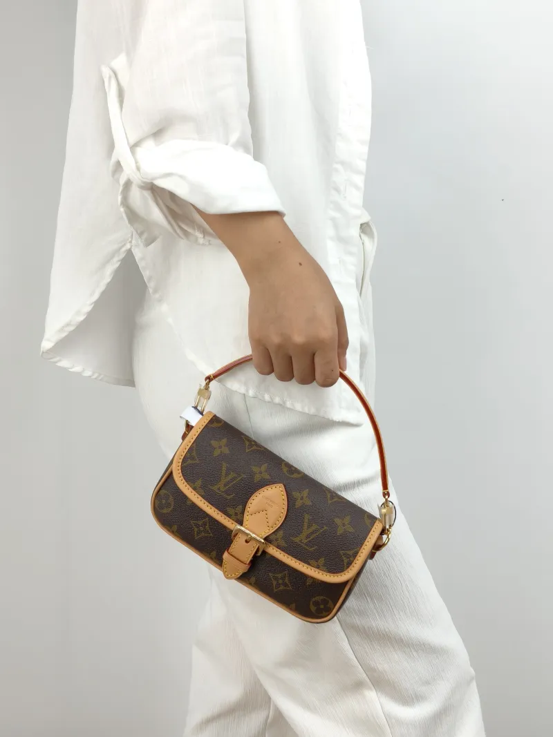 Louis Vuitton Crossbody Bag Diane Baguette Bag Monogram PVC nano 19 × 6 × 10.5 cm — on-model view 1 of 2