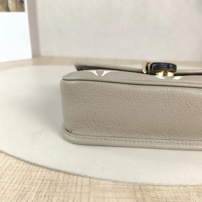 Louis Vuitton Crossbody Bag Diane Baguette Bag Empreinte Embossed Calfskin nano 19 × 6 × 10.5 cm — detail view 9 of 12