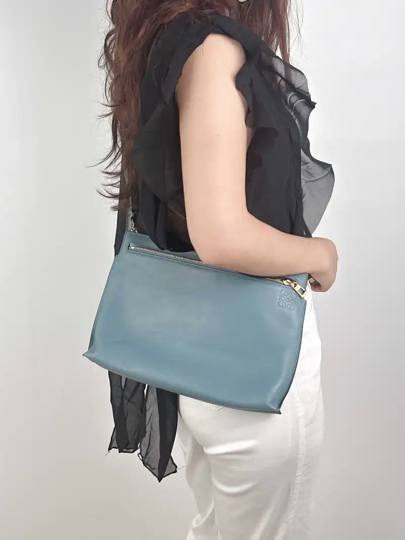 LOEWE Crossbody Bag Calfskin 32 × 5 × 21 cm — on-model view 1 of 2