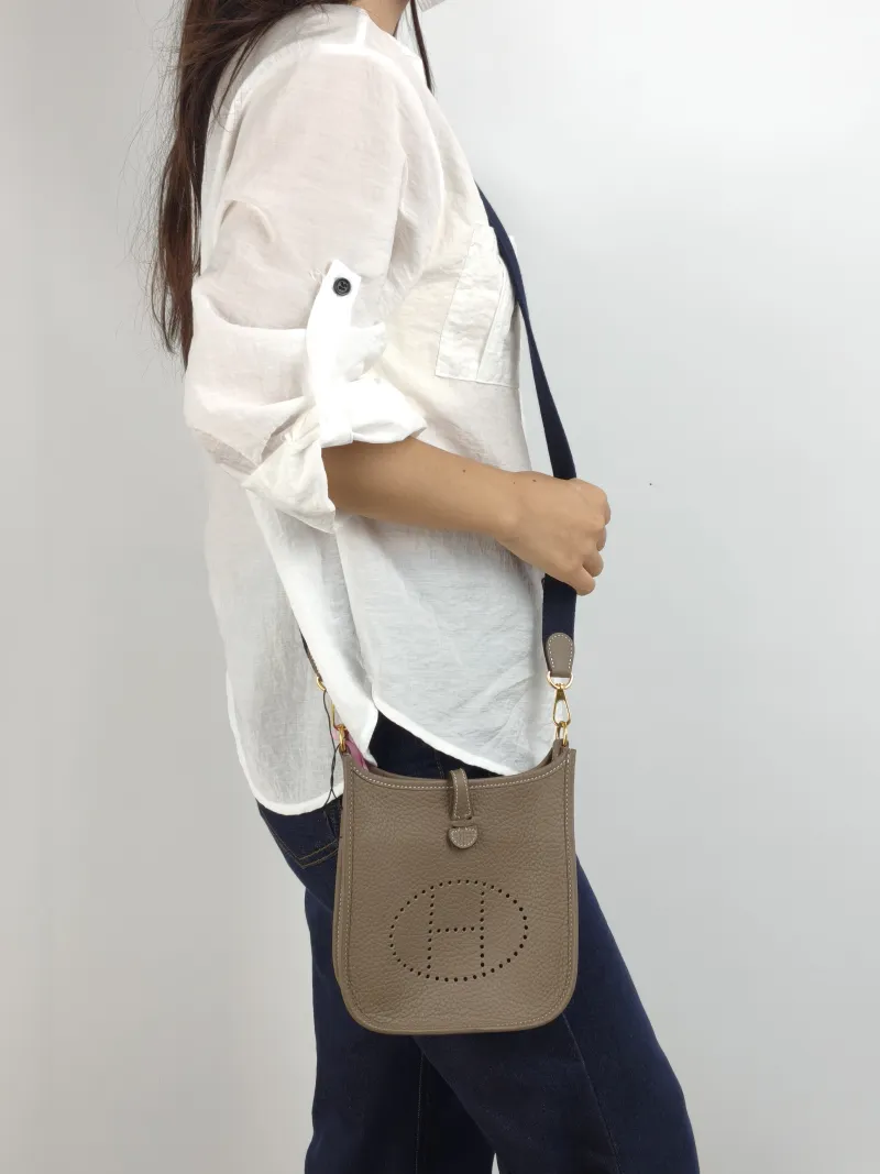 Hermès Crossbody Bag Evelyne Mini 16 Mini 16 TC Calfskin Mini 17 × 5.5 × 18 cm k Blue Shoulder Strap — on-model view 1 of 2