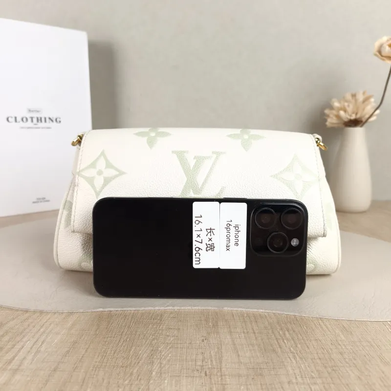 Louis Vuitton Crossbody Bag Favorite White · Green Empreinte Embossed Calfskin Monogram Medium24 × 9 × 14 cm — cover view 2 of 5