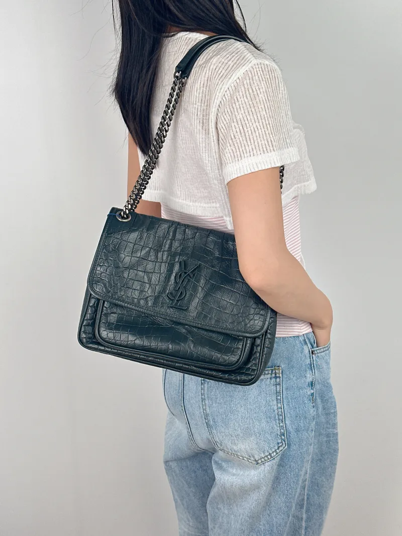 SAINT LAURENT Crossbody Bag Niki D Green Calfskin Medium 28 × 8.5 × 20 cm — on-model view 2 of 2