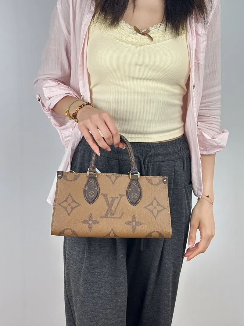 Louis Vuitton Crossbody Bag Onthego East West Monogram PVC Small25 × 10 × 13 cm — on-model view 1 of 2