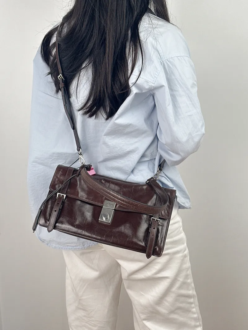 PRADA Top Handle Bag Tote Bag Brown Waxed Leather One Size 31.5 × 11 × 17 cm — on-model view 1 of 2