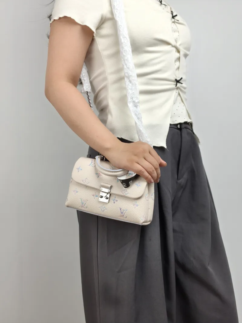 Louis Vuitton Crossbody Bag MADELEINE Calfskin nano 21 × 6 × 12.5 cm — on-model view 1 of 3