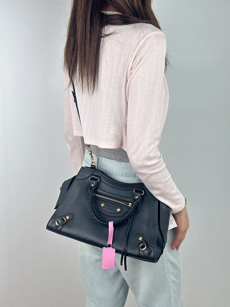 BALENCIAGA Crossbody Bag Neo Classic Black with Gold-Tone Hardware Calfskin Small 33 × 15.5 × 21 cm — on-model view 3 of 3