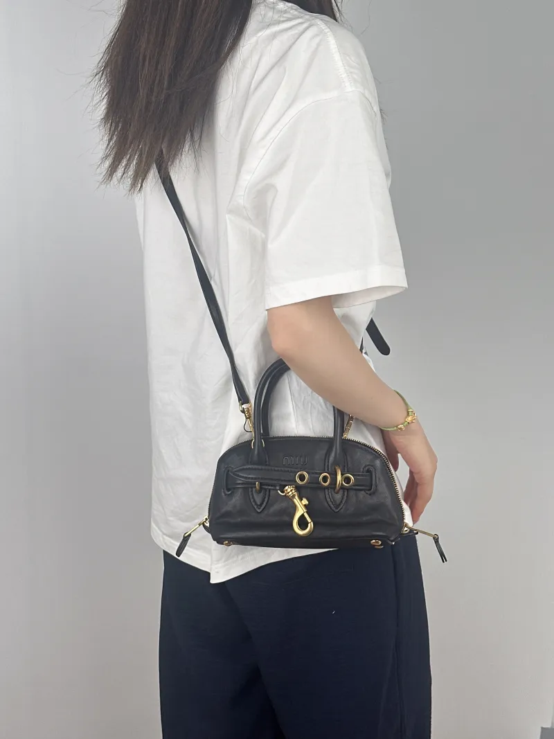 Miumiu Top Handle Bag Aventure Top Handle Bag Black Lambskinmini21 × 8 × 13.2 cm — on-model view 2 of 3